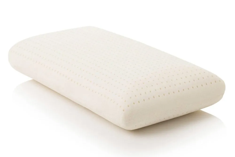 PlushBeds Solid Latex Pillow, a natural Talalay latex pillow with a ventilated pinhole surface